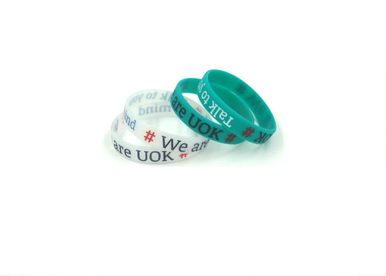 China Custom Logo Custom Silicone Bracelets , Silicone Band Bracelets With Colorful Words Infilled supplier